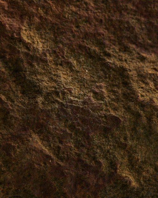 A weathered steel column standing in the studio yard
